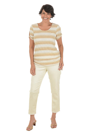 Woman wearing a striped shirt and beige pants on a white background