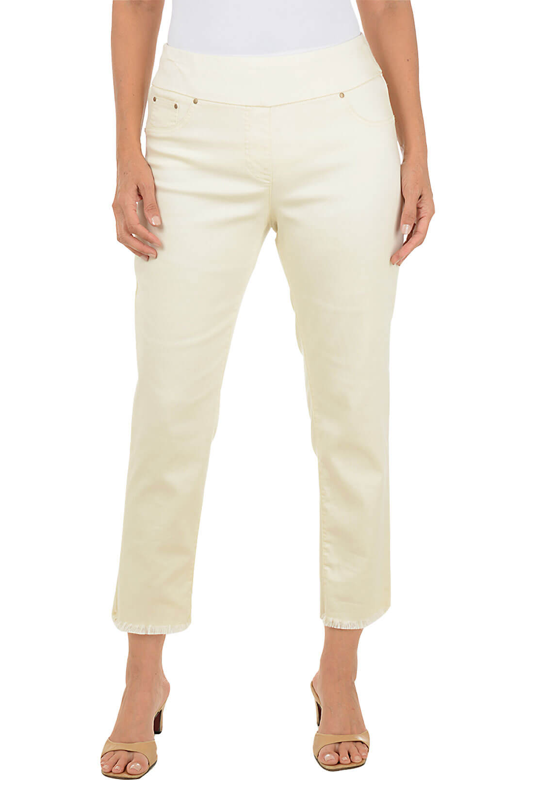 Beige pants worn by a person on a white background