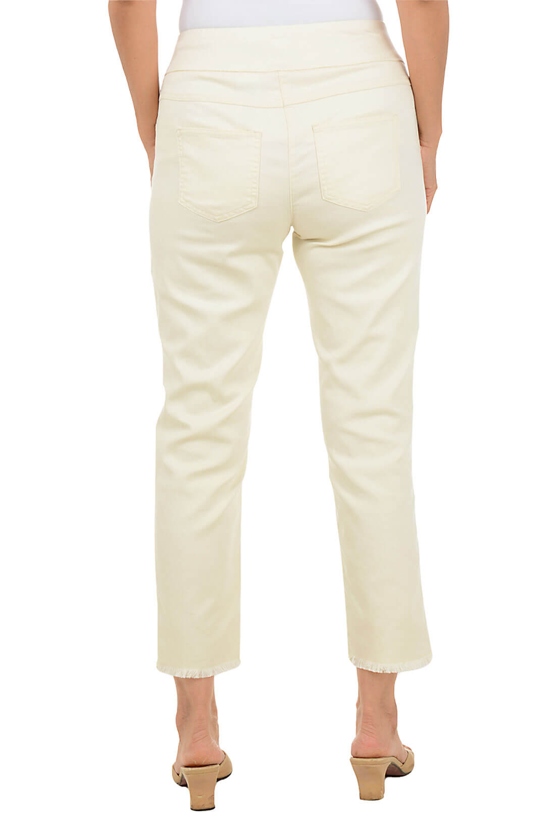 Beige pants worn by a person on a white background