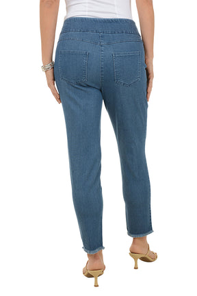 Person wearing blue jeans on a white background