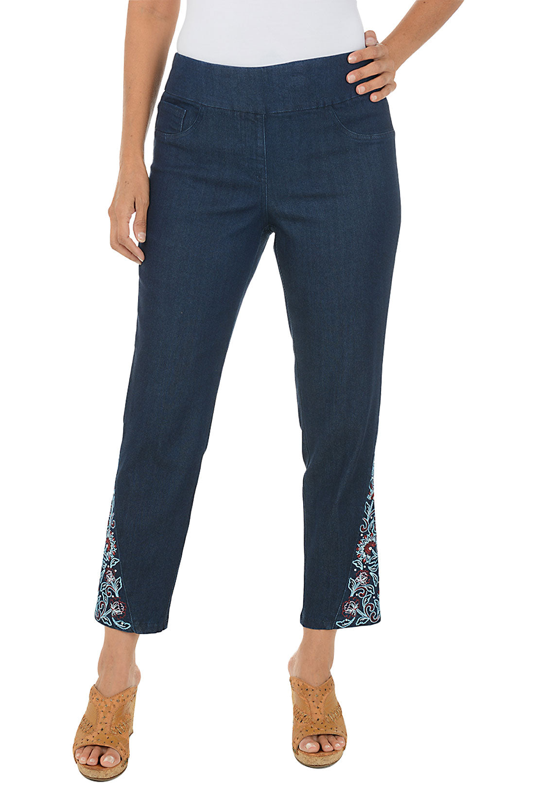 Navy pants with floral embroidery on a white background.