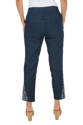 Navy pants with floral embroidery on a white background. Back shot.