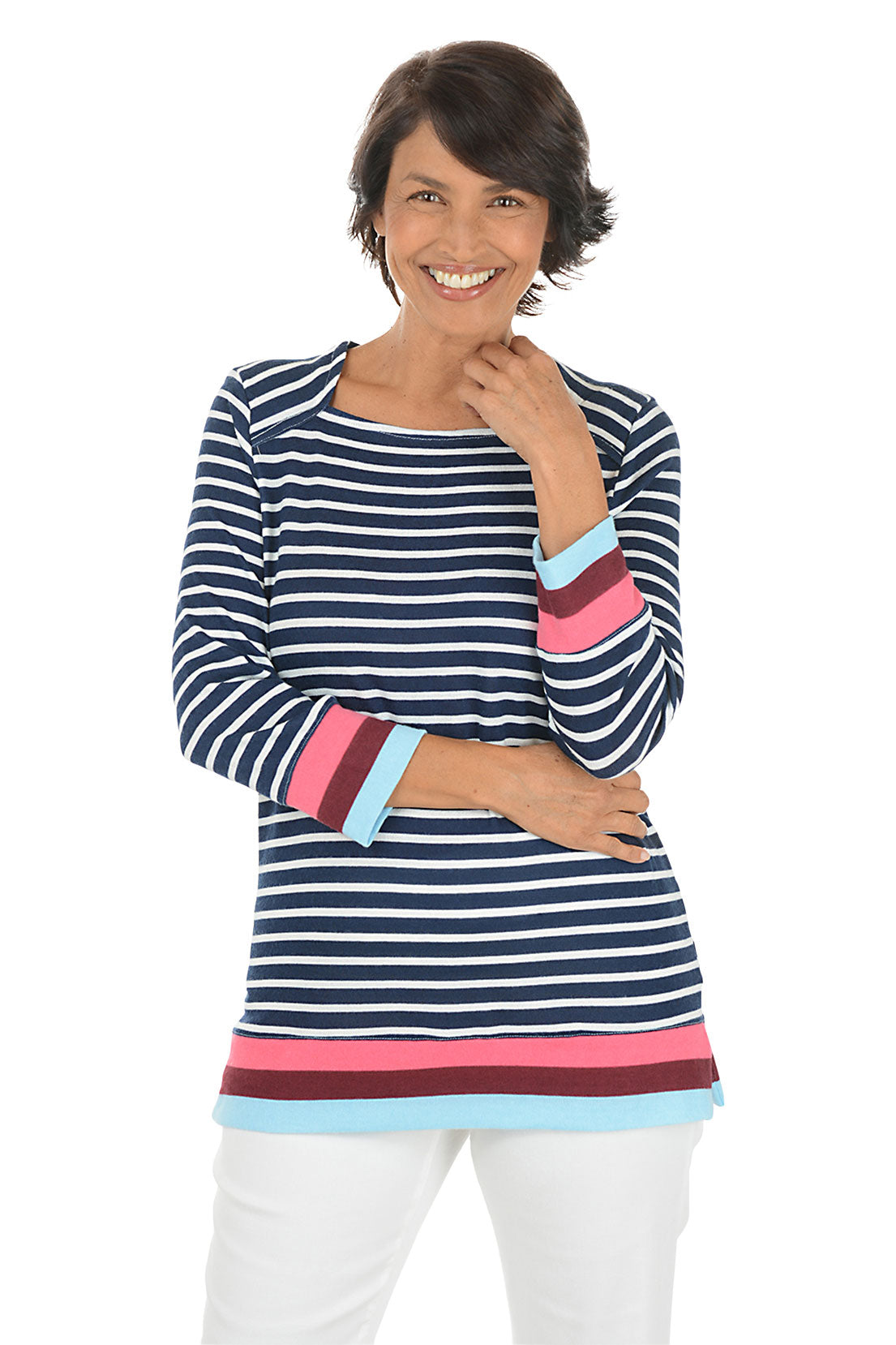 Woman wearing a navy and white striped long-sleeve top with colorful cuffs on a white background.
