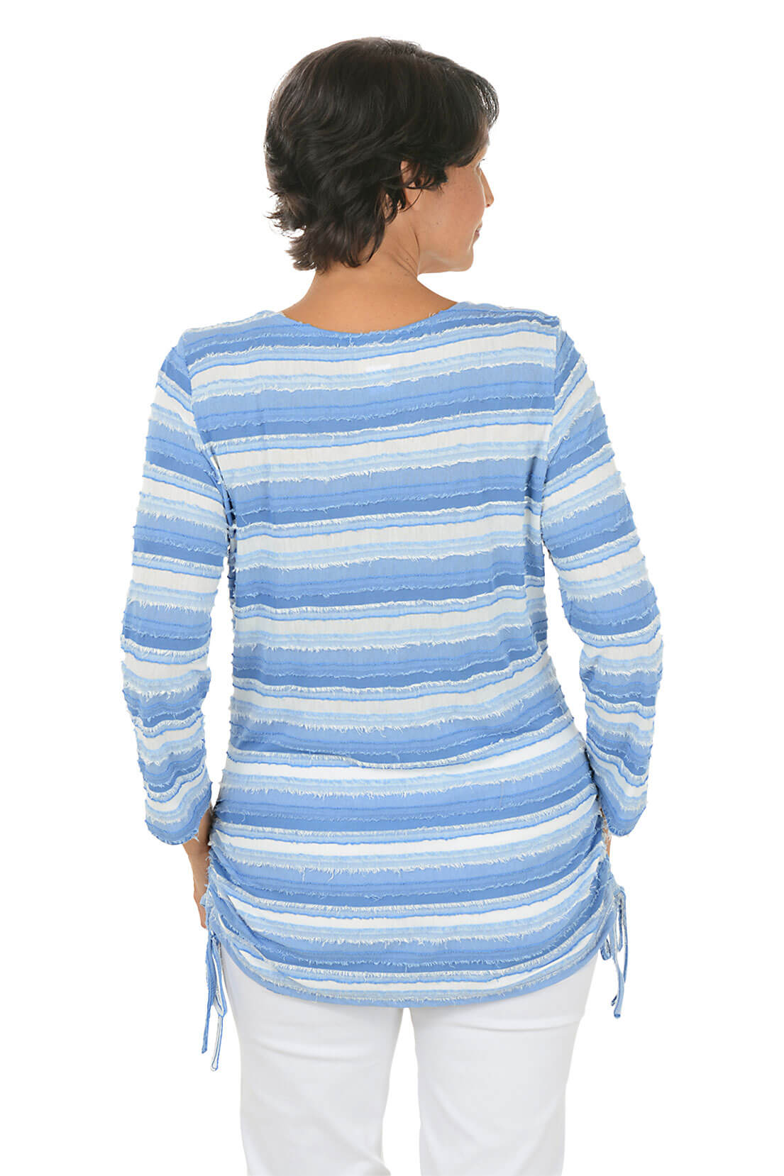 A back shot of a model wearing a chambray multi white striped sweater on a white background