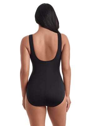 Black swimsuit worn by a model on a white background