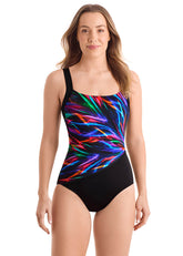 Woman wearing a colorful swimsuit with a black background