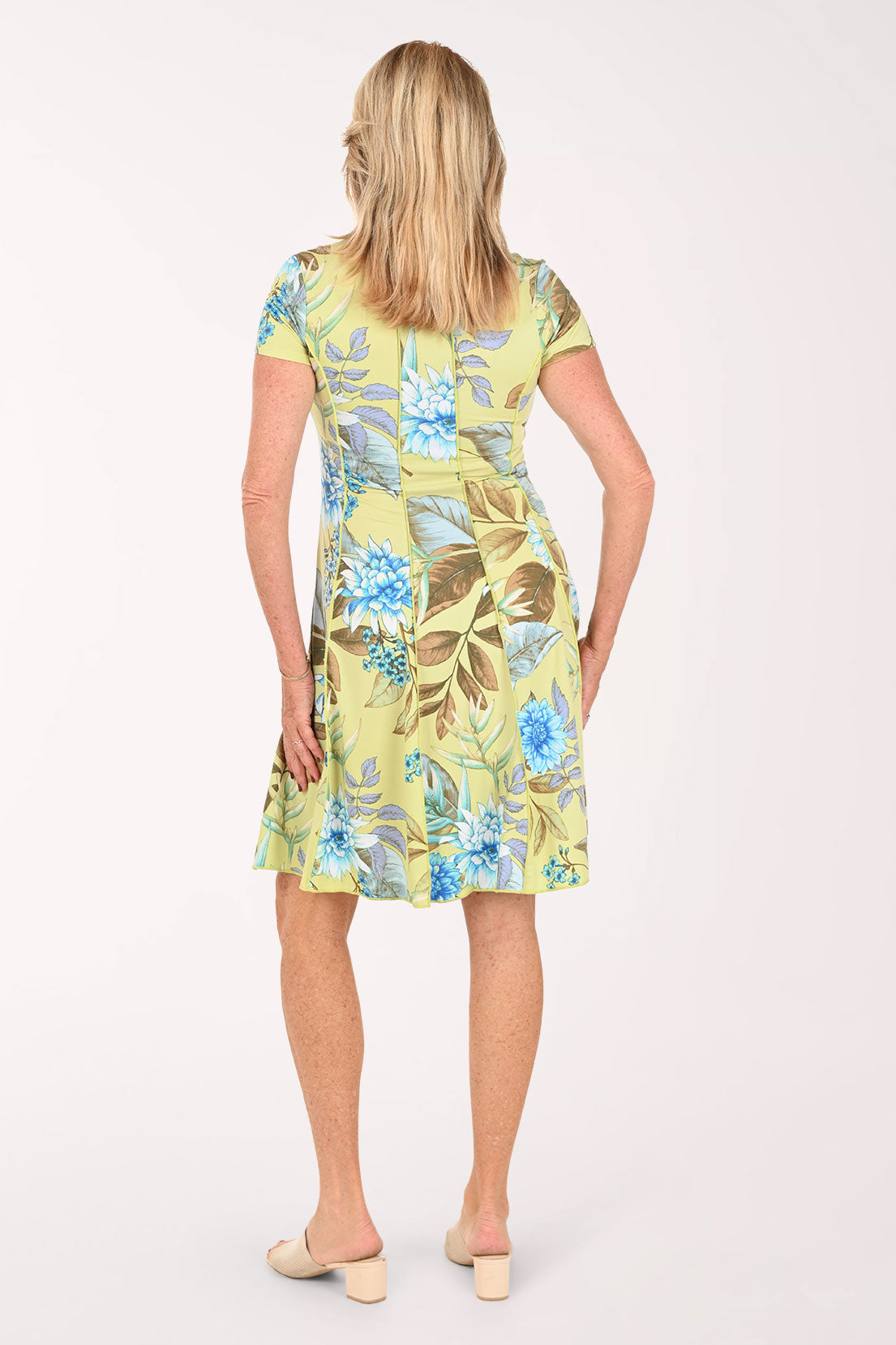 Woman wearing a short sleeve yellow multi dress 