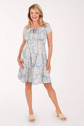 Woman wearing a short sleeve light blue dress 