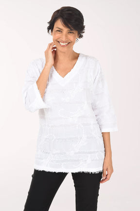 Woman wearing a white blouse with black pants on a white background