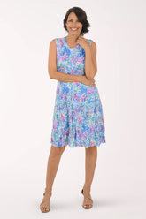 Woman wearing a floral dress on a white background