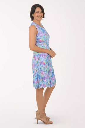 Woman wearing a floral dress on a white background