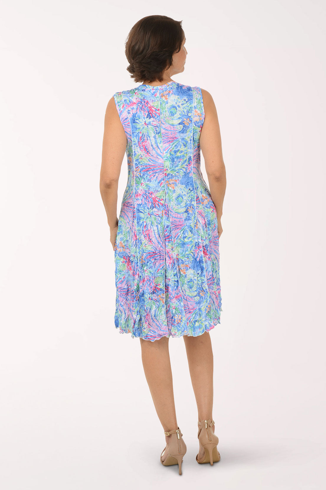 Woman wearing a floral dress on a white background