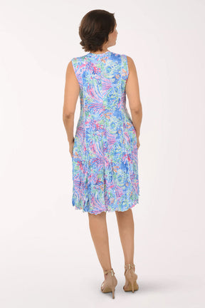 Woman wearing a floral dress on a white background