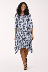 Woman wearing a floral dress on a white background