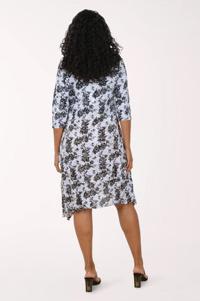 Woman wearing a floral dress on a white background