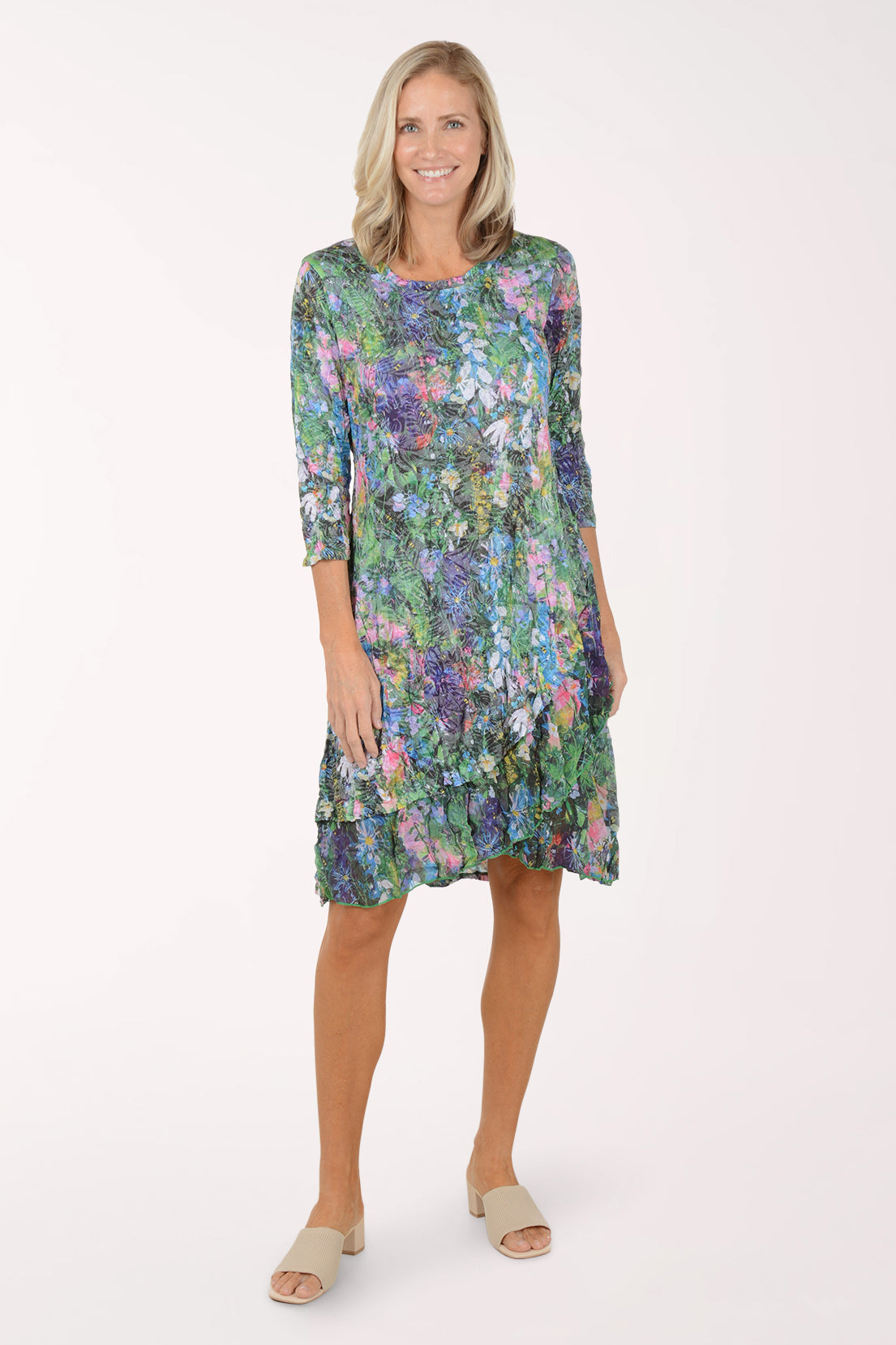Woman wearing a floral dress on a white background