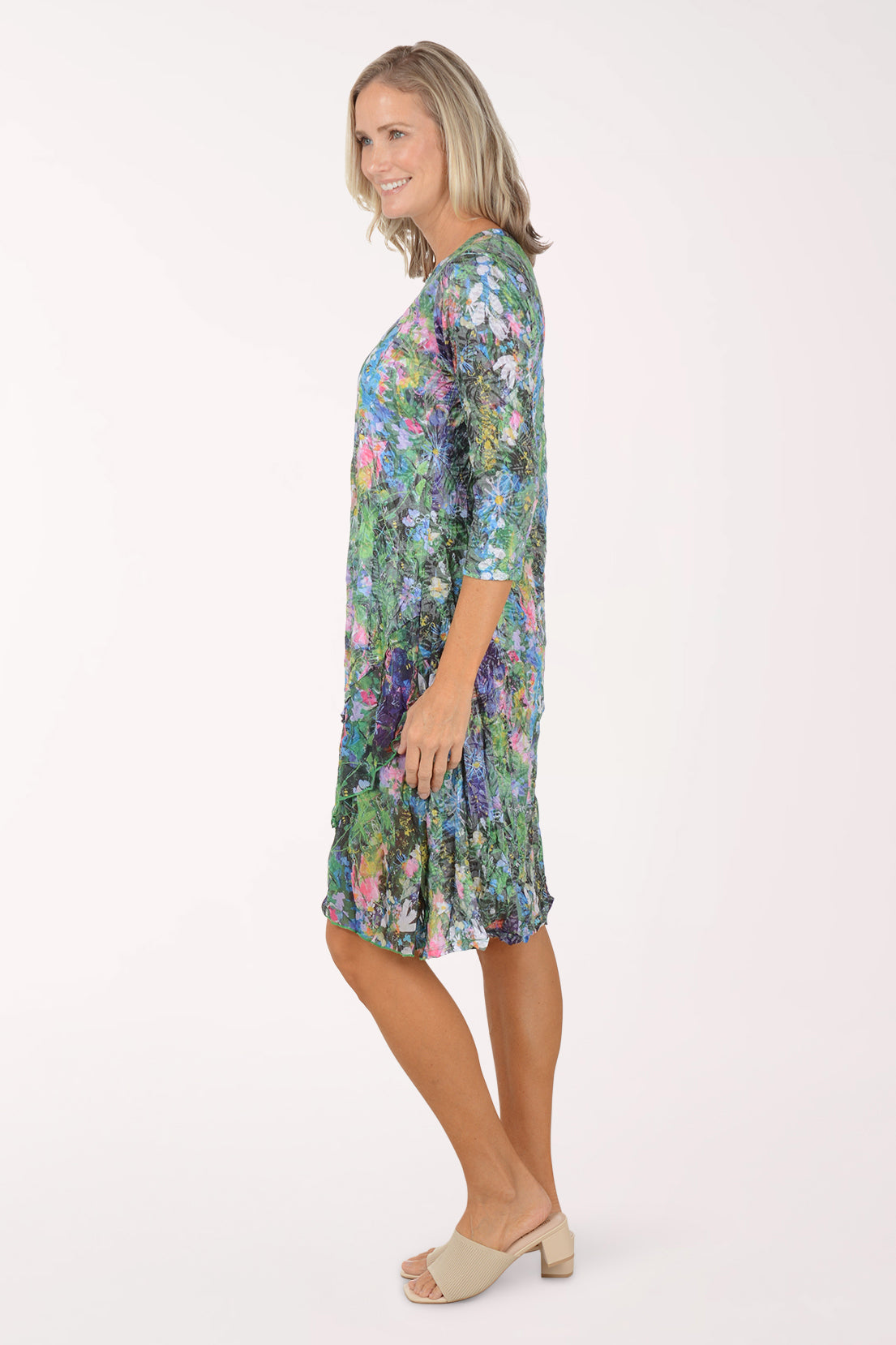 Woman wearing a floral dress on a white background