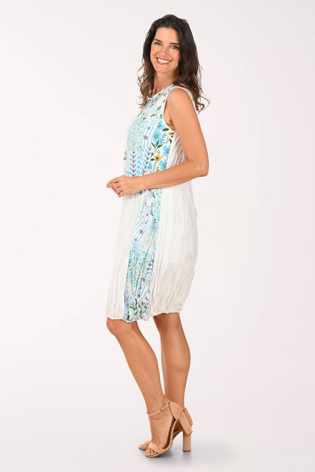 Woman wearing a colorful dress on a white background