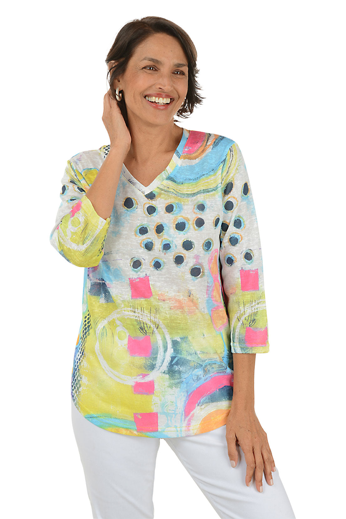 Woman wearing a colorful abstract patterned top on a white background. Second front shot.