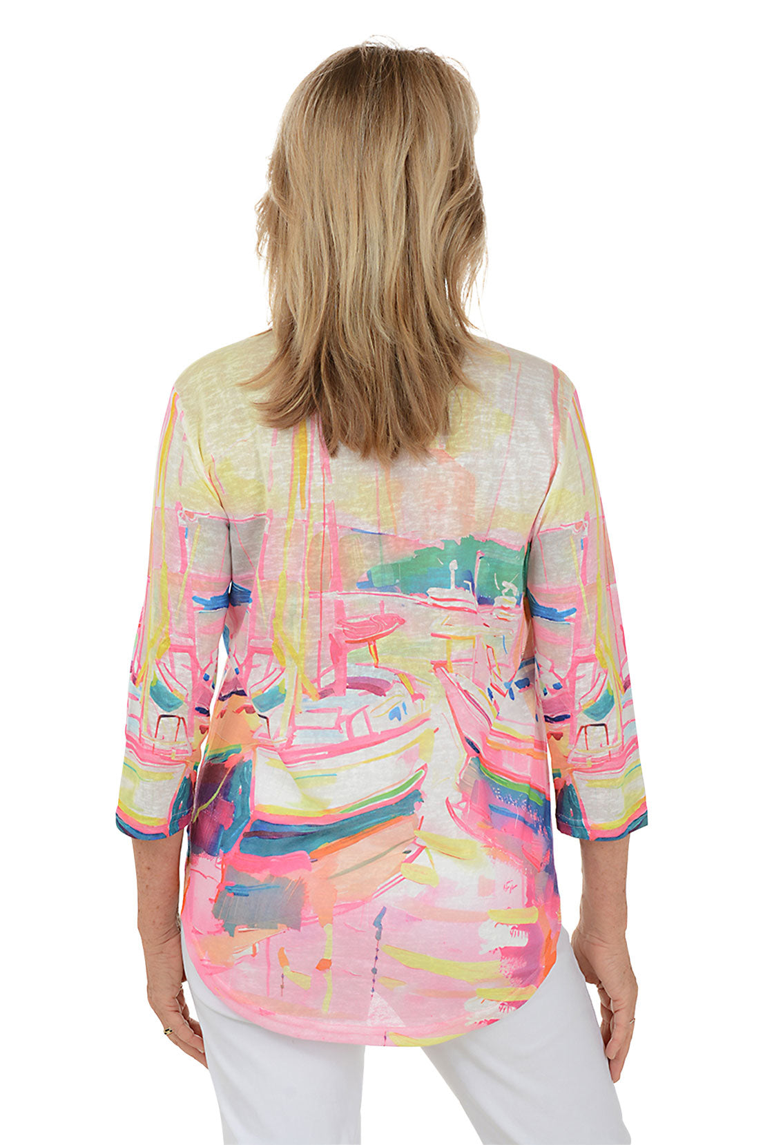A woman wearing a multi-colored 3/4 sleeve v-neck top with a boat watercolor pattern. Back shot.