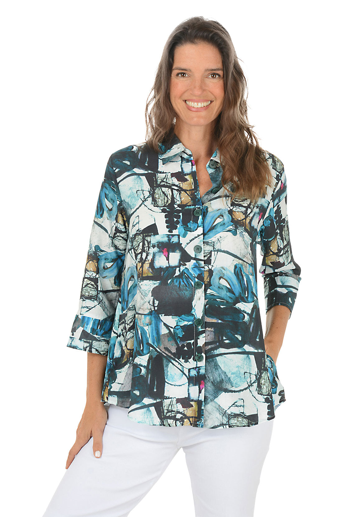 Woman wearing a colorful patterned blouse on a white background.