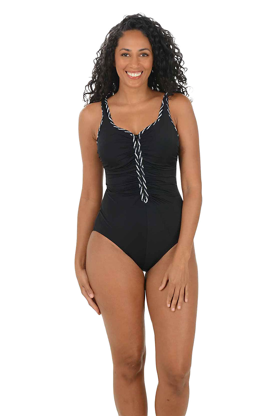Woman wearing a black swimsuit with black and white decorative straps on a white background. Second front shot.