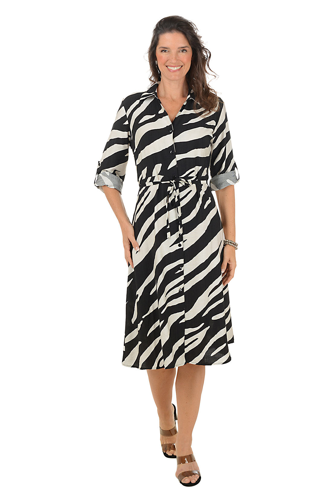 Woman wearing a zebra print dress on a white background.