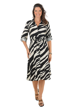 Woman wearing a zebra print dress on a white background.