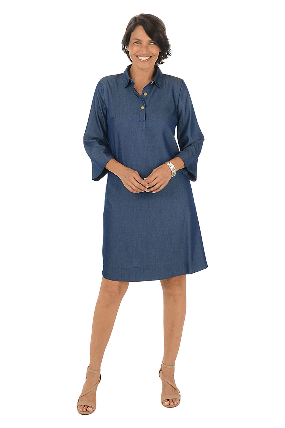 Woman wearing a blue dress on a white background.