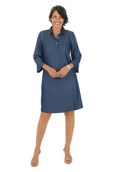 Woman wearing a blue dress on a white background.