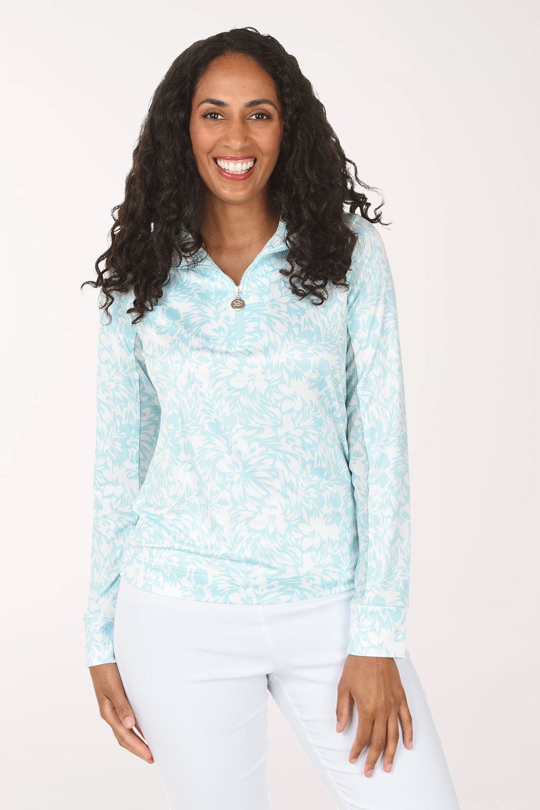 Woman wearing a light blue patterned long-sleeve shirt on a white background