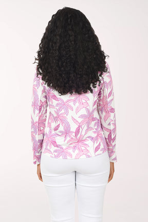 Woman wearing a pink palm leaf patterned jacket on a white background