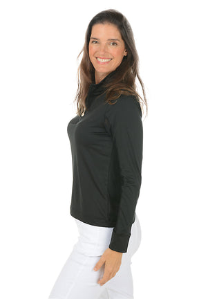 Woman wearing a black long-sleeve top and white pants on a white background. Side shot.