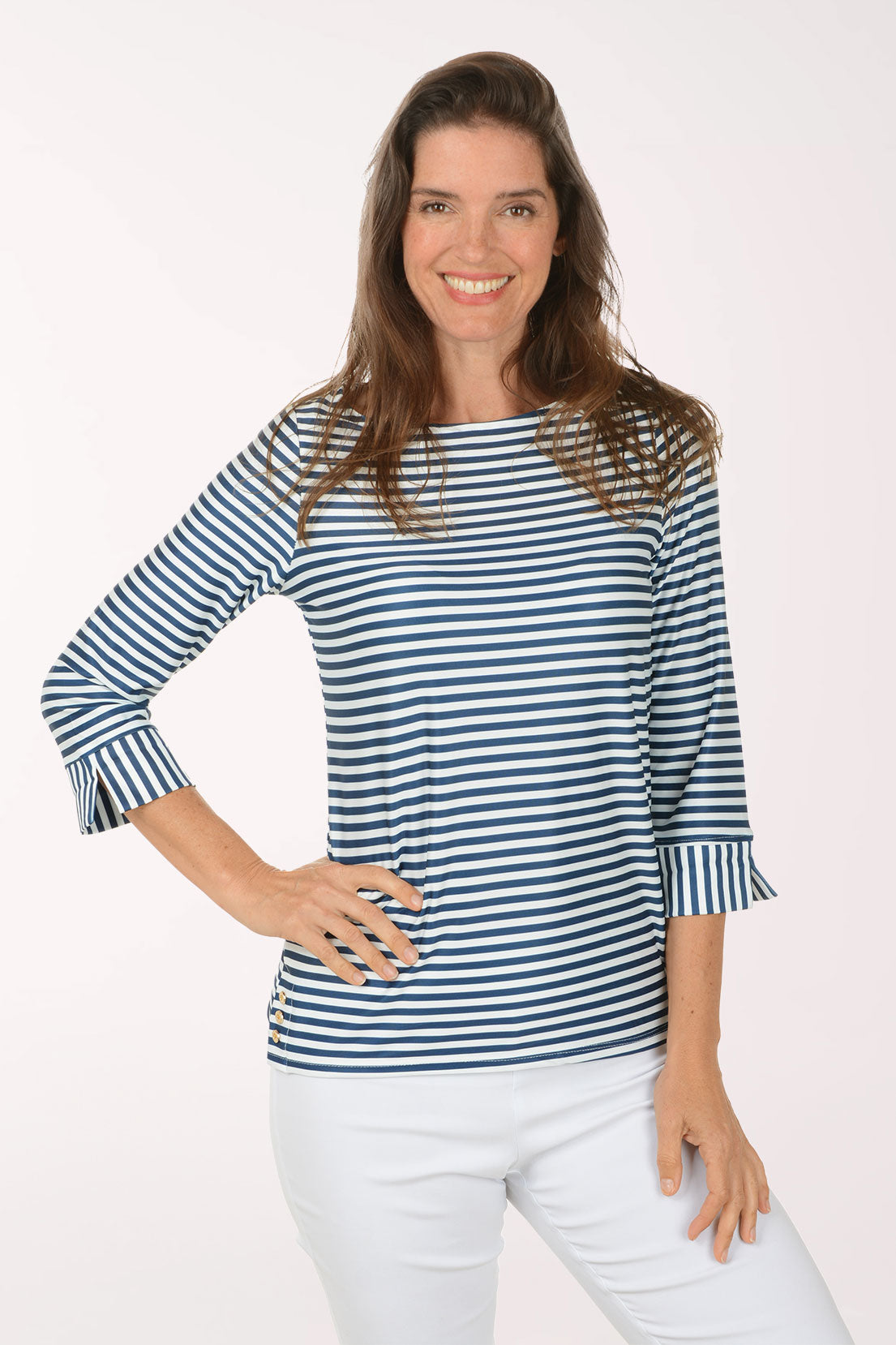 Woman wearing a 3/4 sleeve striped navy and white top.