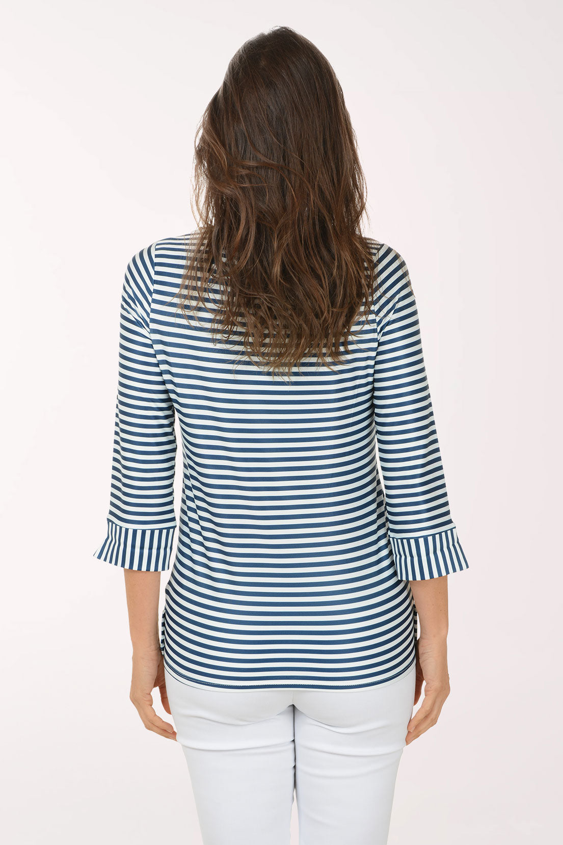 Woman wearing a 3/4 sleeve striped navy and white top.
