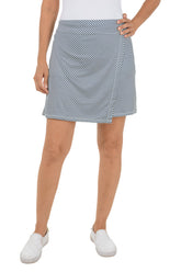 Person wearing a striped skirt on a white background.