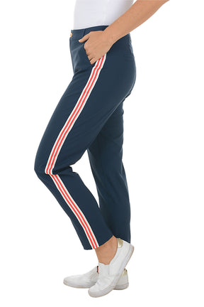 Navy pants with red stripes worn by a person on a white background