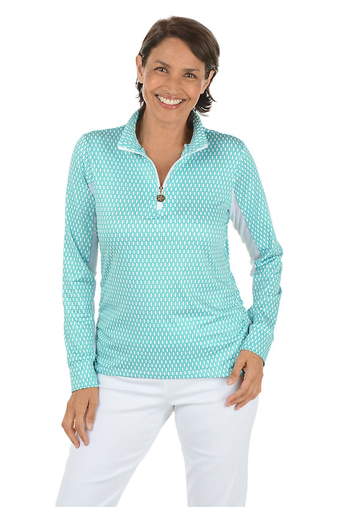 Woman wearing a teal patterned long-sleeve shirt with a white background