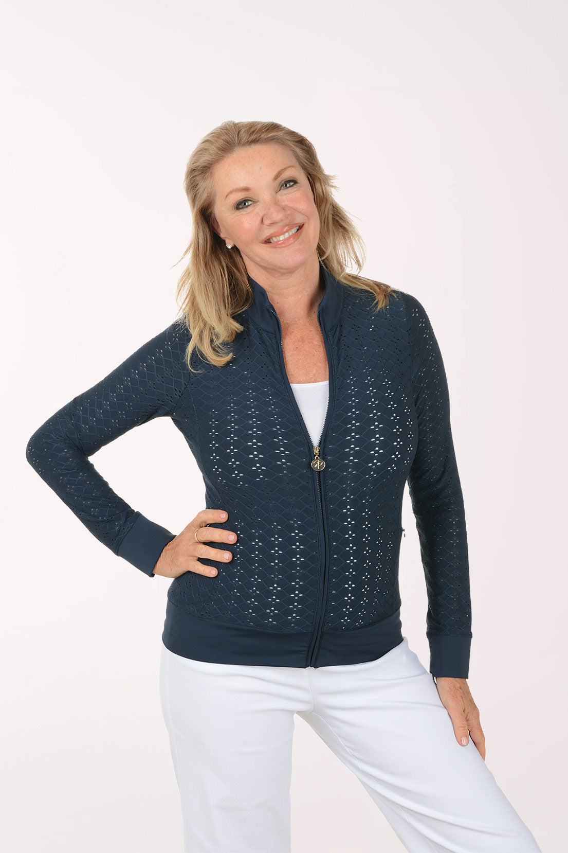 Woman wearing a navy blue jacket with a white background