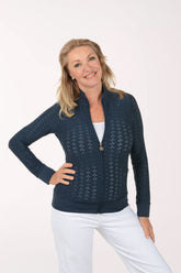 Woman wearing a navy blue jacket with a white background