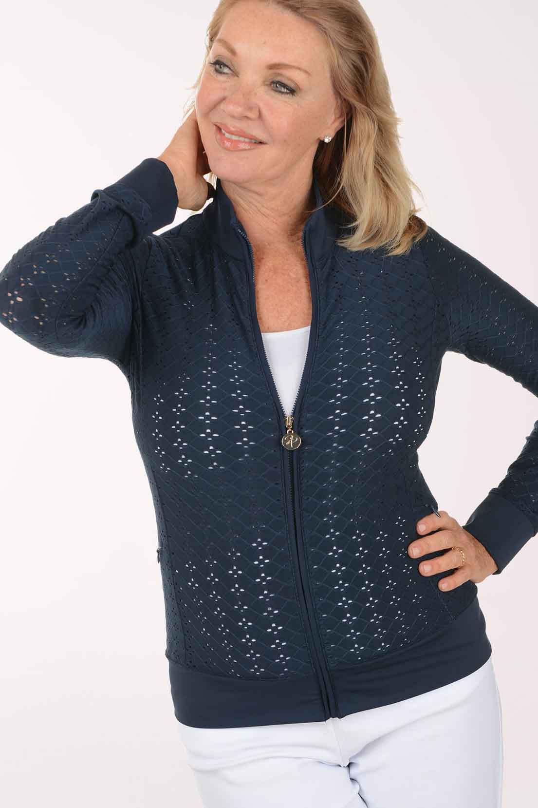 Woman wearing a navy blue jacket with a white background