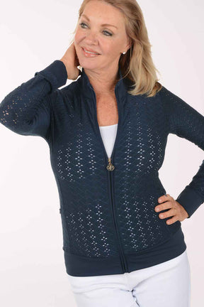 Woman wearing a navy blue jacket with a white background