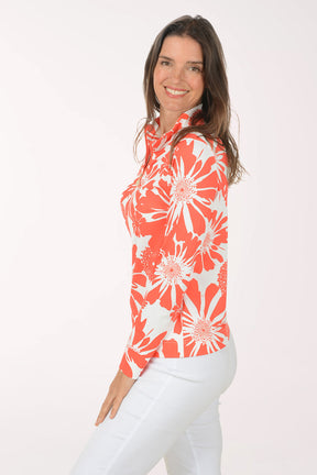 Woman wearing a red and white floral blouse on a white background