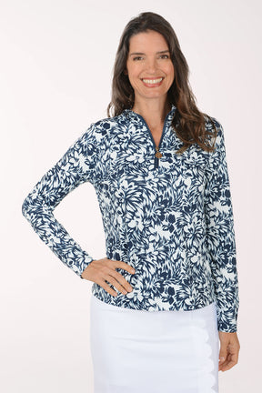 Woman wearing a blue floral patterned shirt on a white background