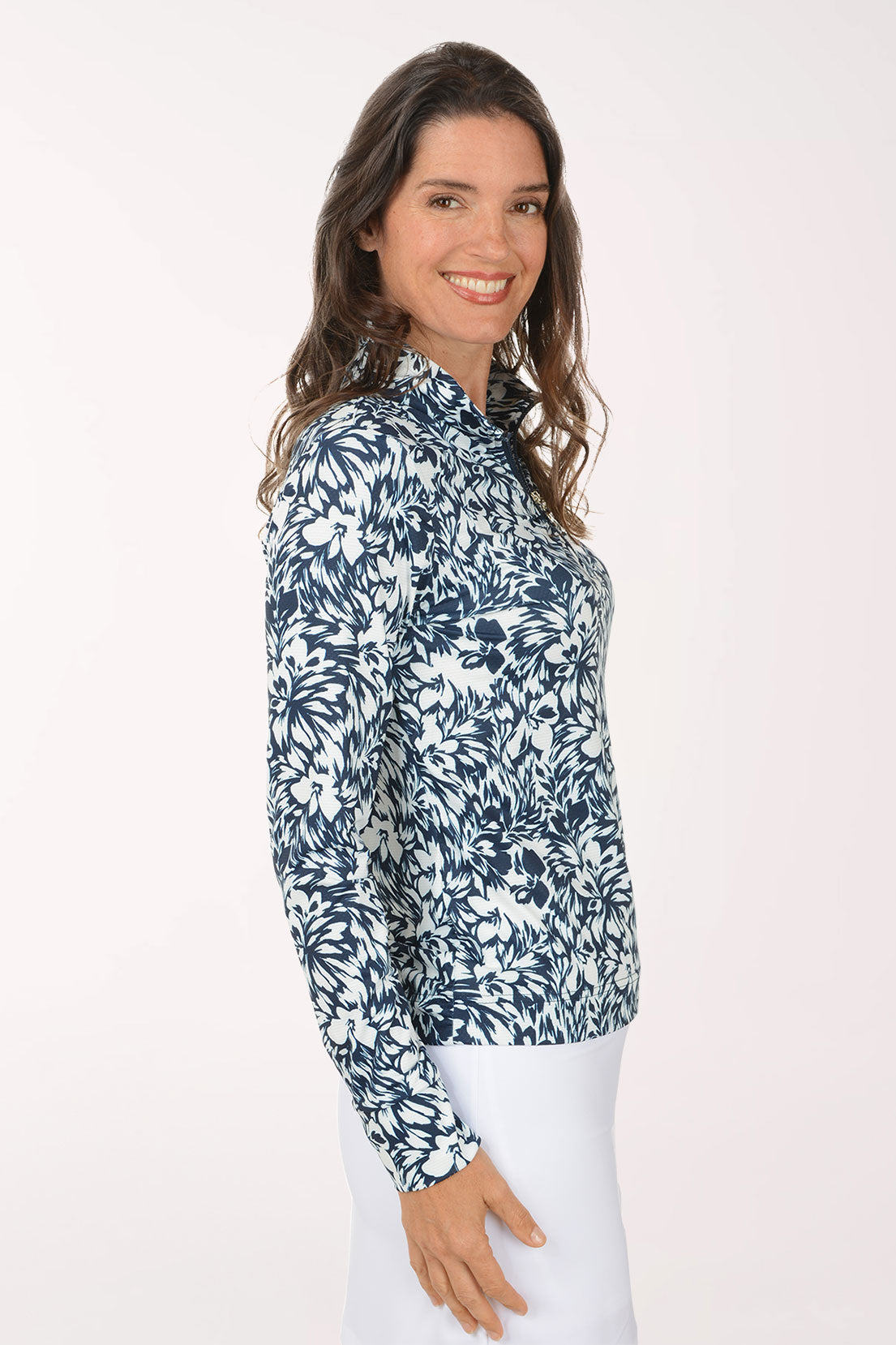 Woman wearing a blue floral patterned shirt on a white background