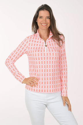 Woman wearing a pink patterned long-sleeve shirt on a white background