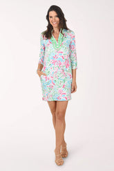 Woman wearing a colorful dress with a white background