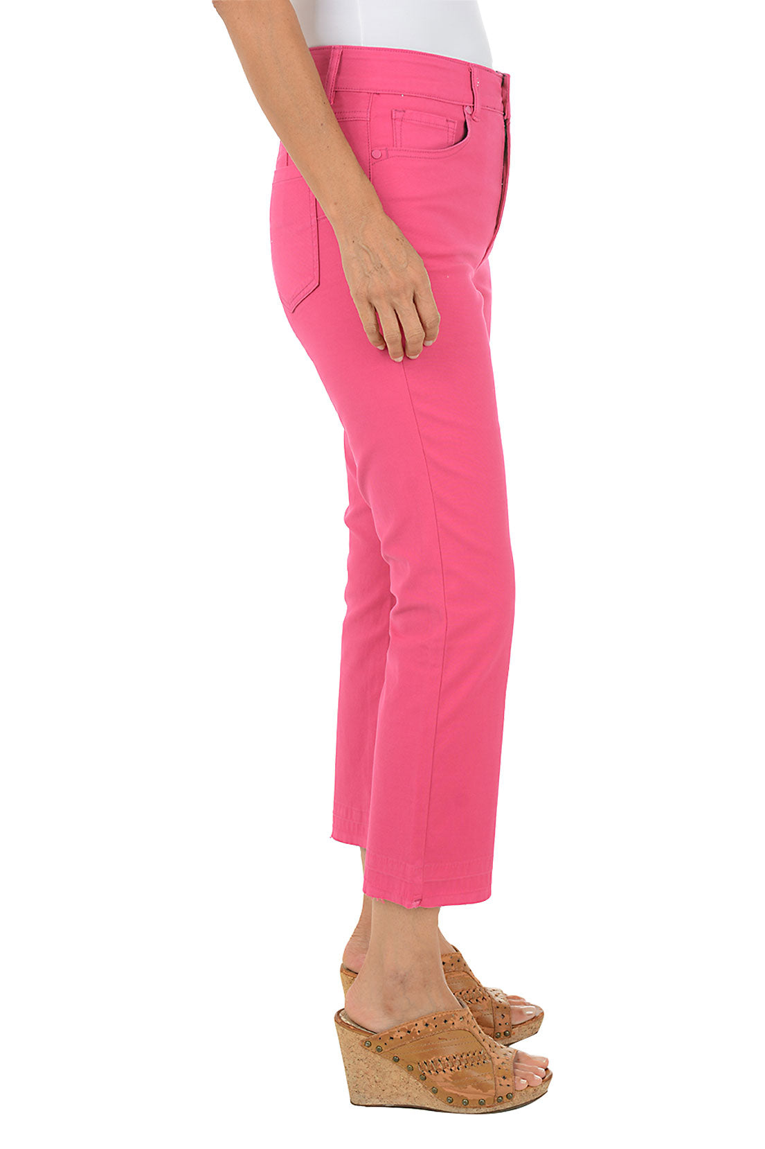 Person wearing bright pink pants on a white background. Side shot.