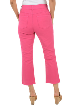 Person wearing bright pink pants on a white background. Back shot.