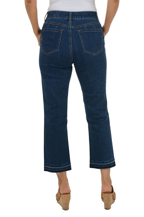 Person wearing dark blue jeans on a white background. Back shot.